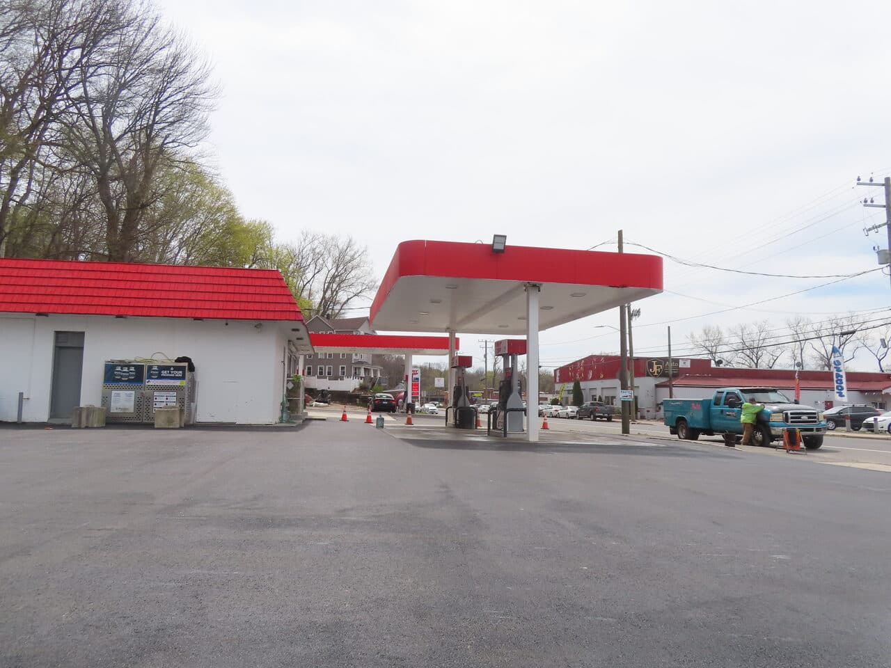 Gas Station Parking Lot Paving project in Waterbury, CT — finished lot with canopy and building