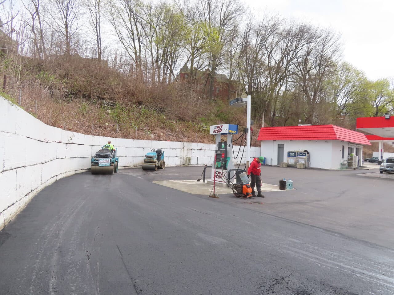 Gas Station Parking Lot Paving project in Waterbury, CT — rollers compacting fresh asphalt