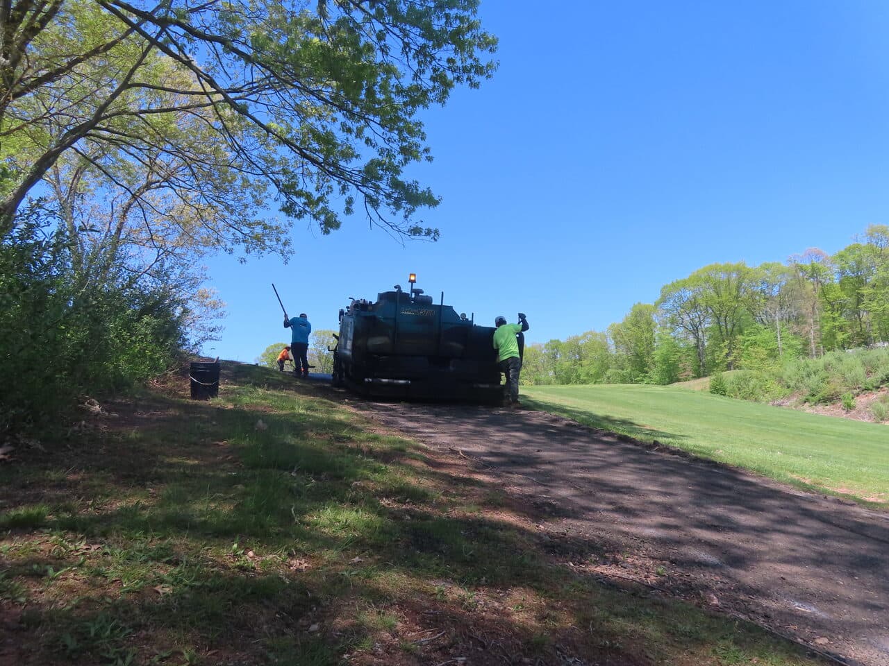 Golf Course Cart Path Paving project in Hamden, CT — paver working on cart path