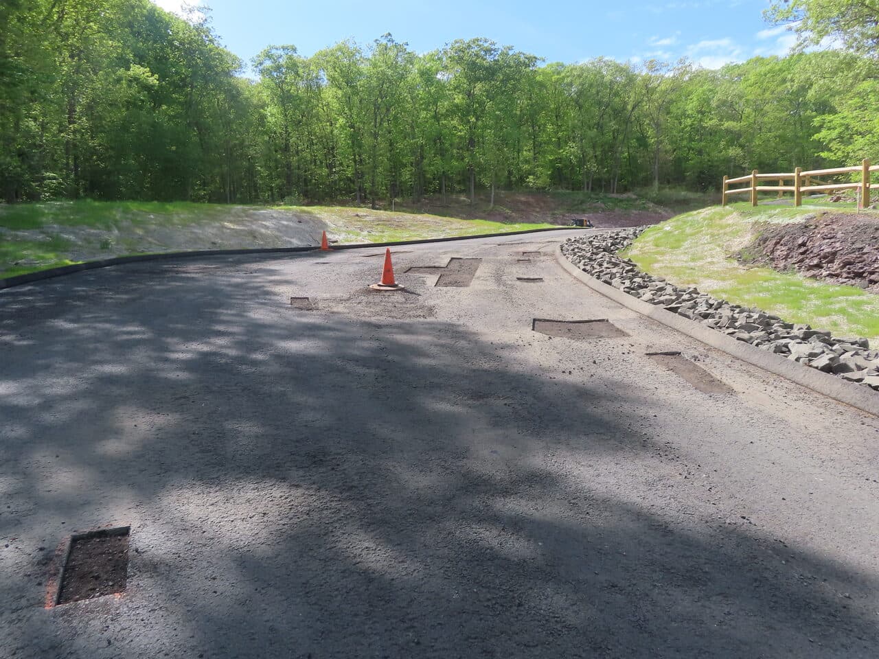 Golf Course Cart Path Paving project in Hamden, CT — wide new asphalt path with patches