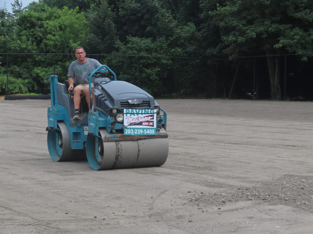 Athletic Facility Parking Lot Paving project in Rhode Island, RI — Maisano roller compacting base