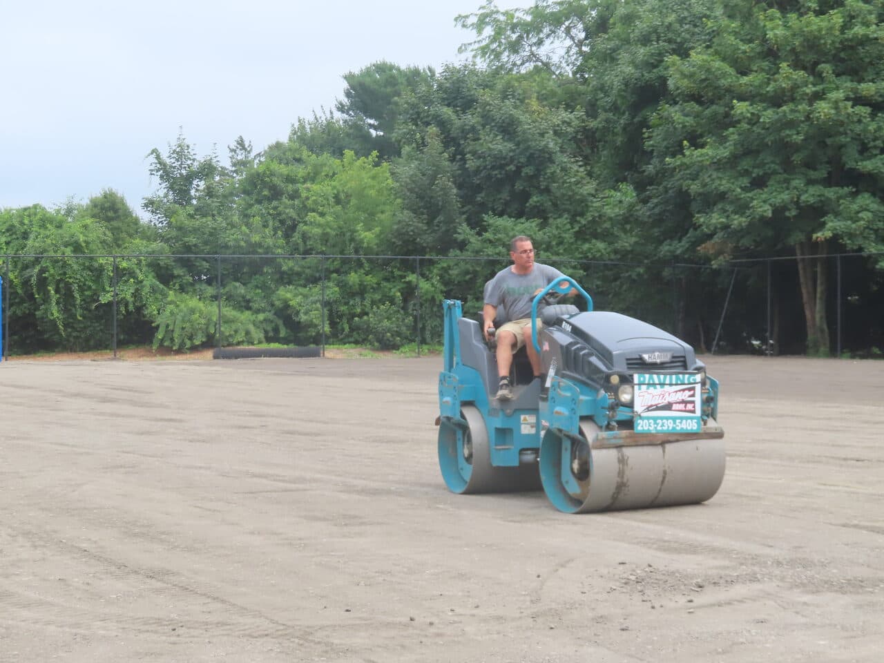 Athletic Facility Parking Lot Paving project in Rhode Island, RI — branded roller compacting base
