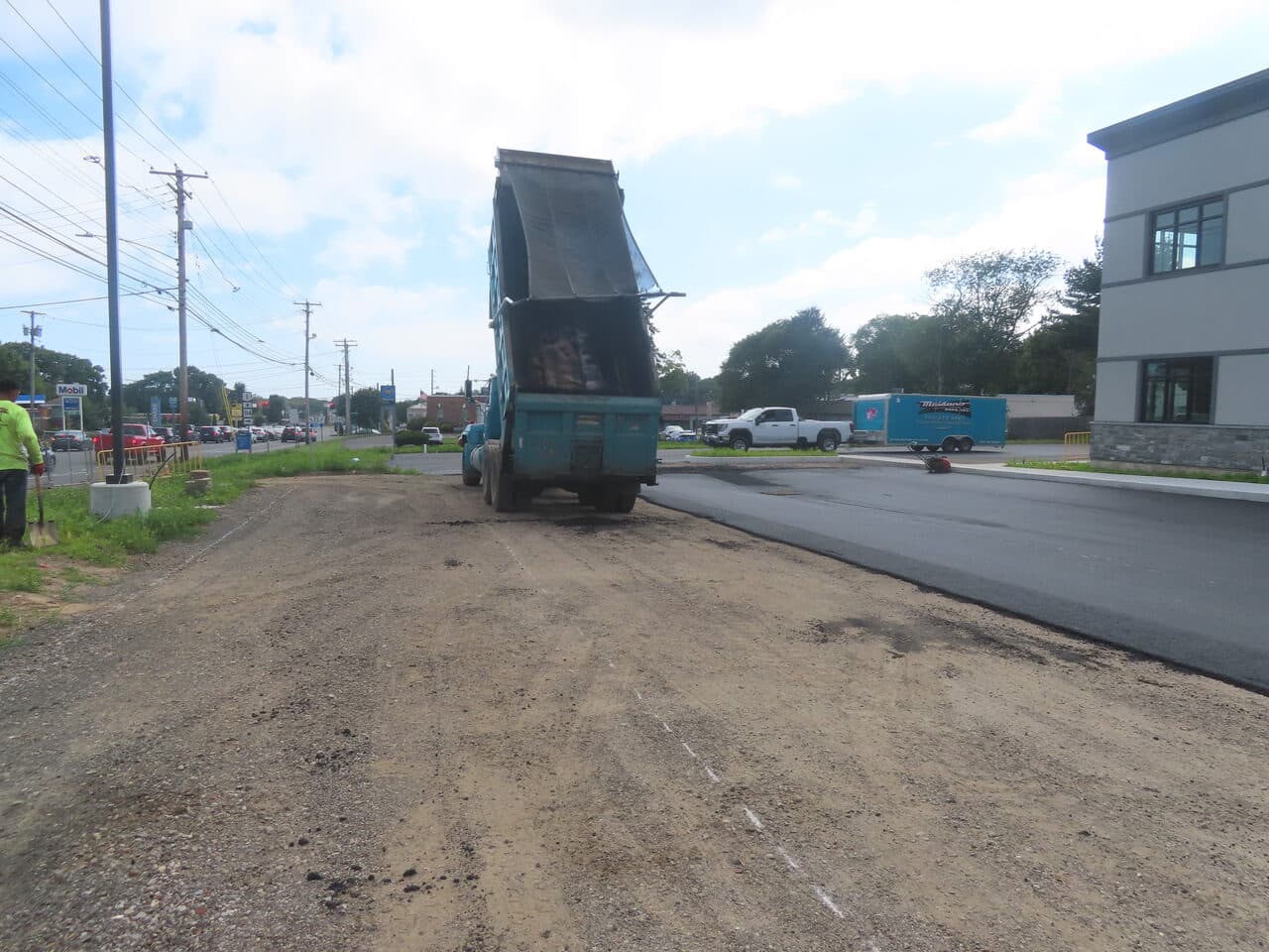 Commercial Parking Lot Paving project in Orange, CT — dump truck on graded base beside new lot