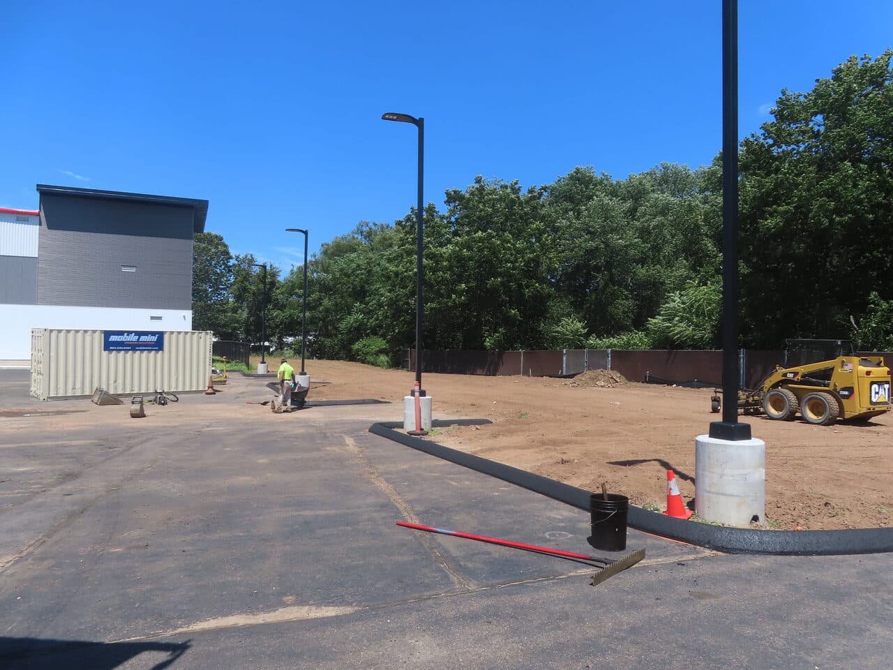 Commercial Parking Lot Repair & Patching project in Wallingford, CT — new curb edge along graded lot