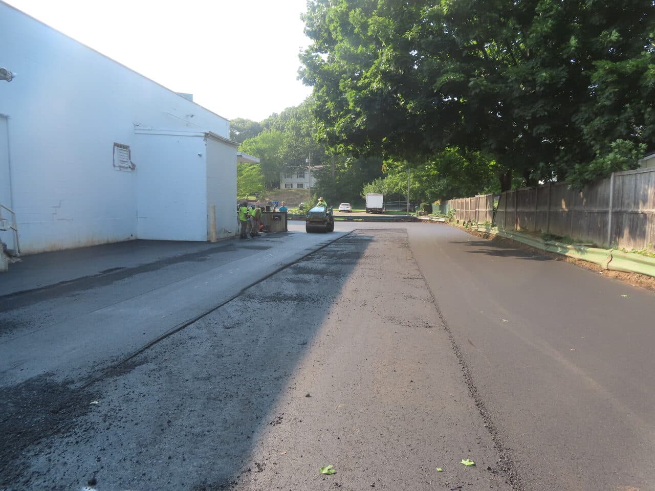 Commercial Parking Lot Paving project in Branford, CT — fresh asphalt behind warehouse