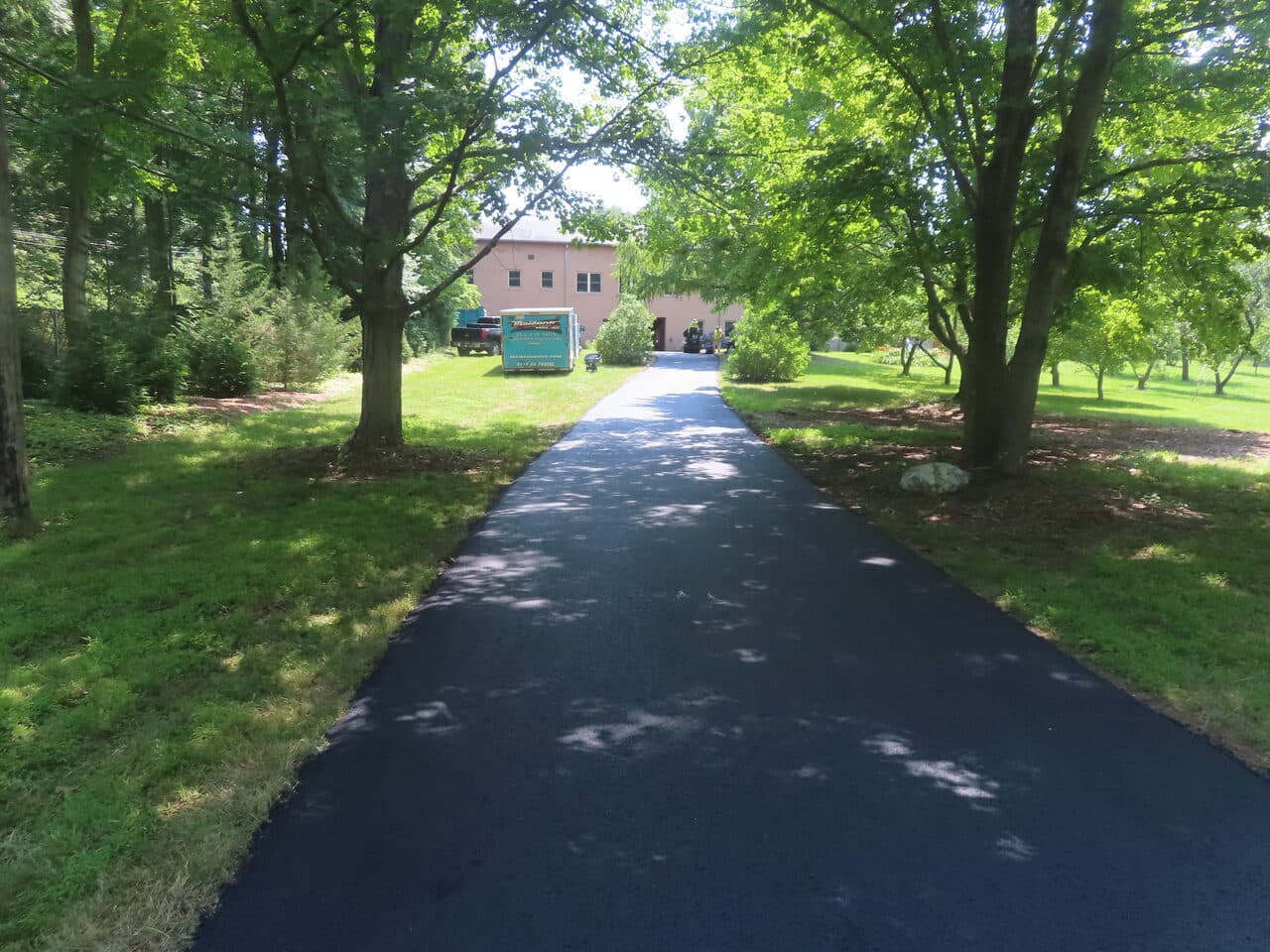 Pedestrian Trail & Parking Lot Paving project in Guilford, CT — long driveway toward house