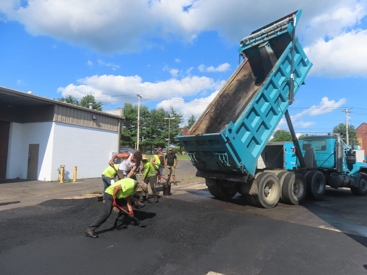 Commercial Parking Lot Paving project in North Haven, CT — crew shoveling asphalt by dump truck