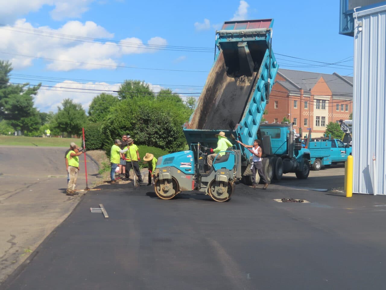 Commercial Parking Lot Paving project in North Haven, CT — crew and roller with dump truck