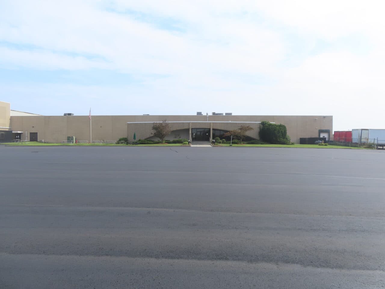 Commercial Parking Lot Paving project in East Haven, CT — finished lot facing office facade