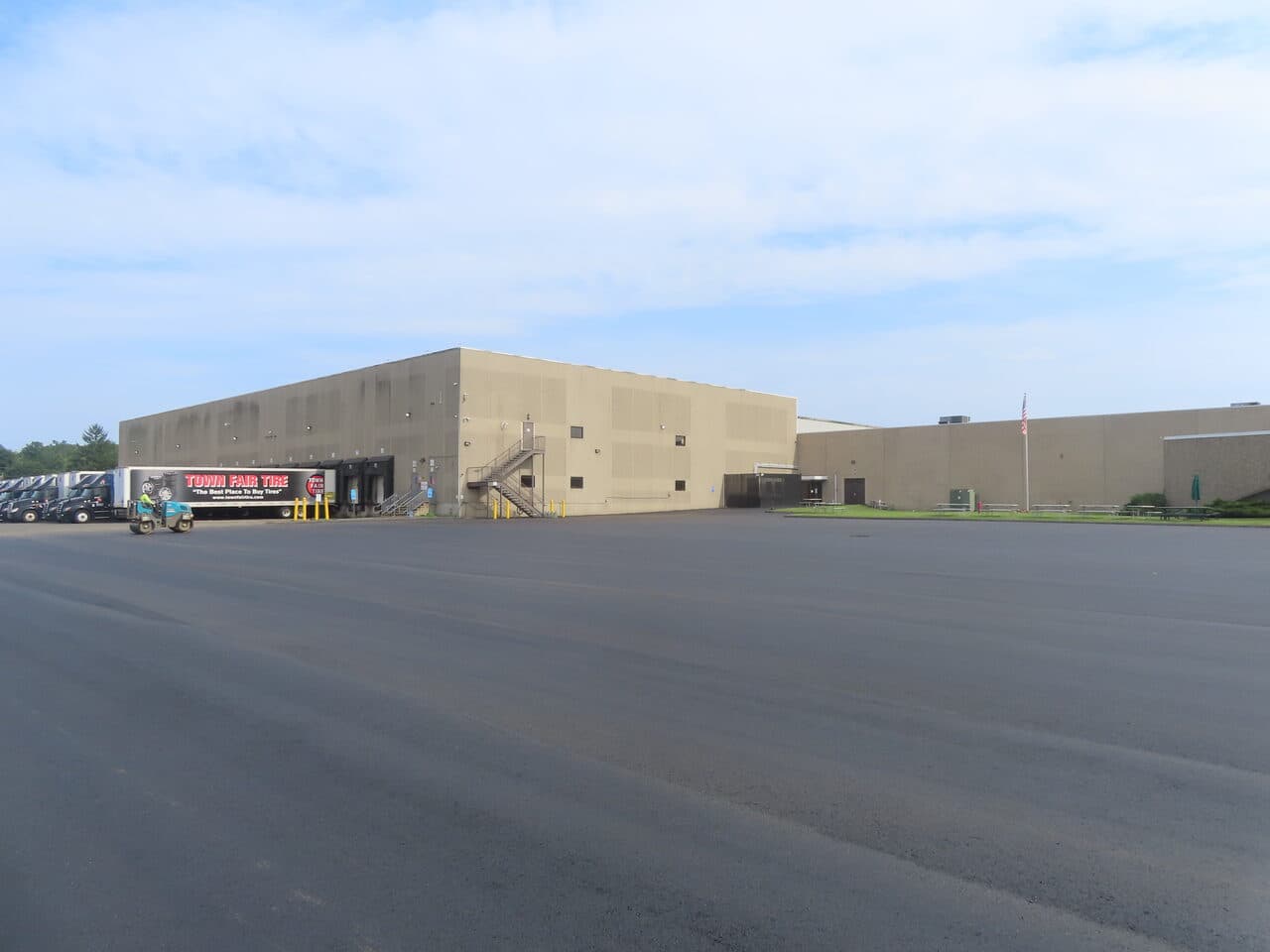 Commercial Parking Lot Paving project in East Haven, CT — finished lot with tire warehouse