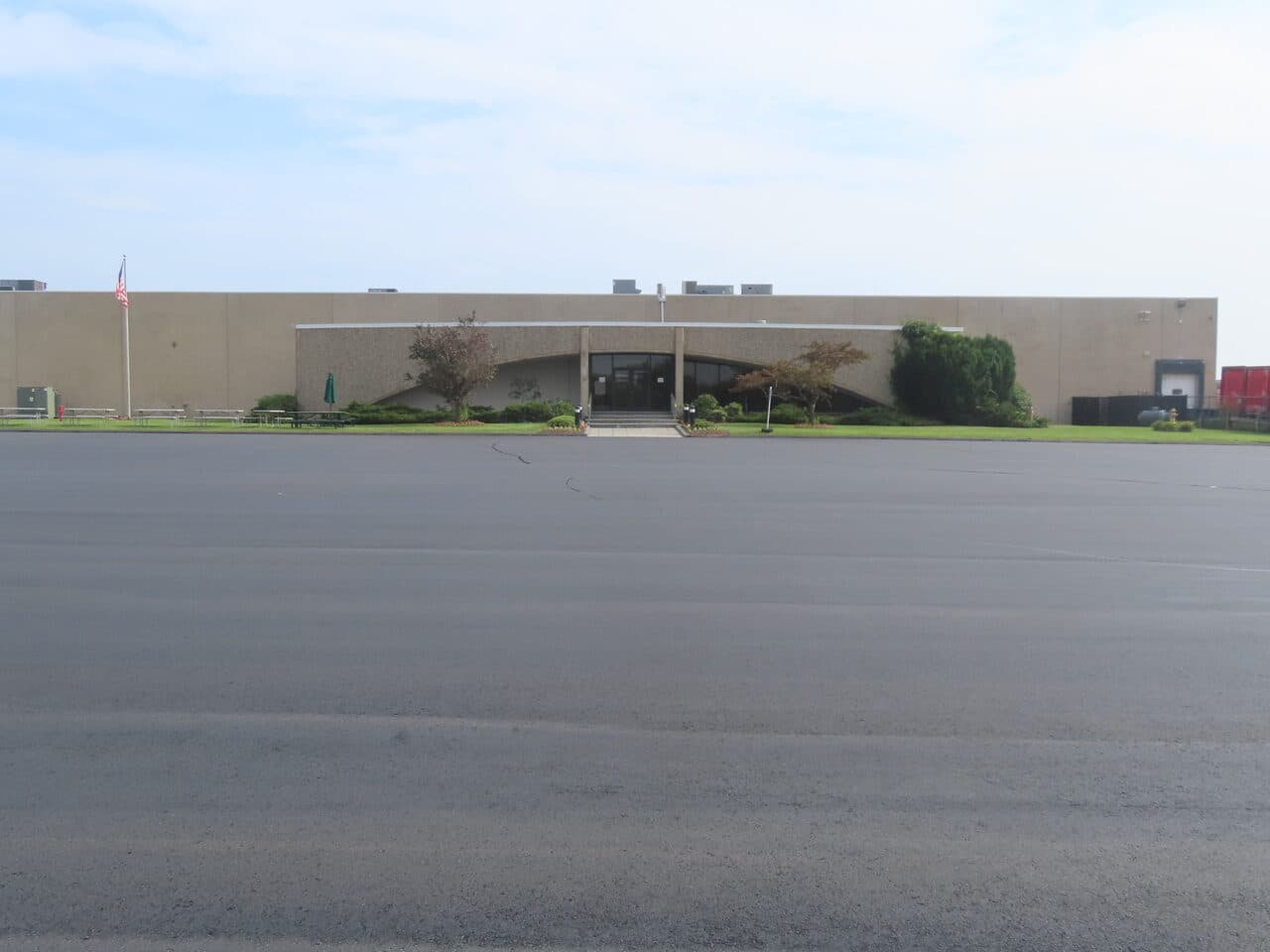 Commercial Parking Lot Paving project in East Haven, CT — finished lot with office entrance