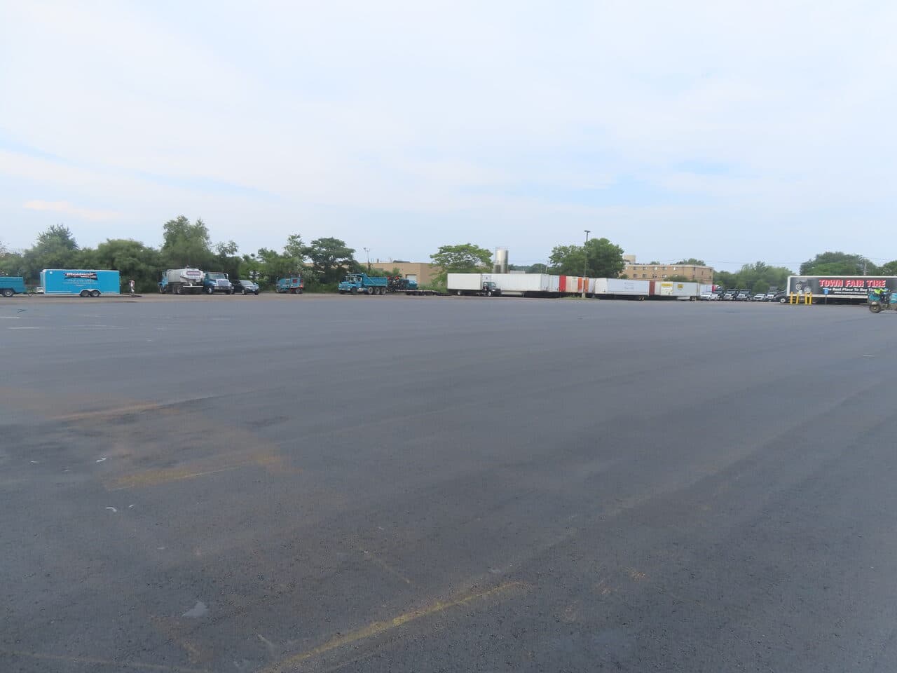 Commercial Parking Lot Paving project in East Haven, CT — finished lot with staged equipment
