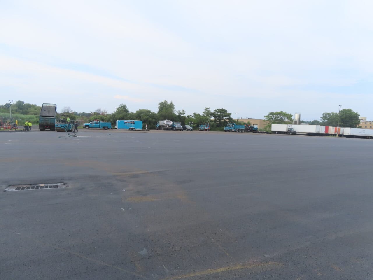 Commercial Parking Lot Paving project in East Haven, CT — finished lot with paving fleet