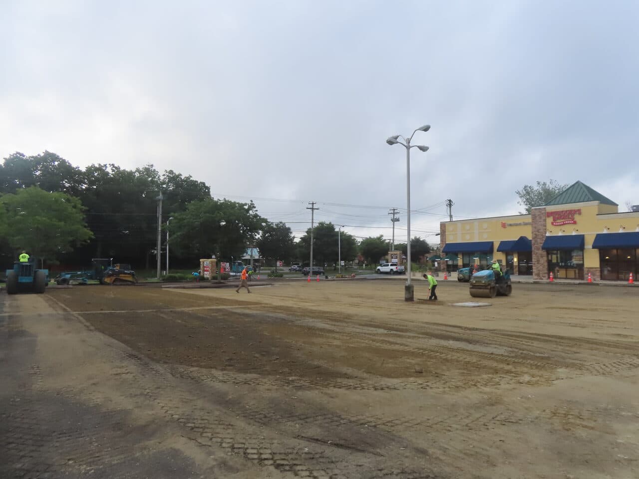 Commercial Parking Lot Paving project in Shelton, CT — graded lot with roller