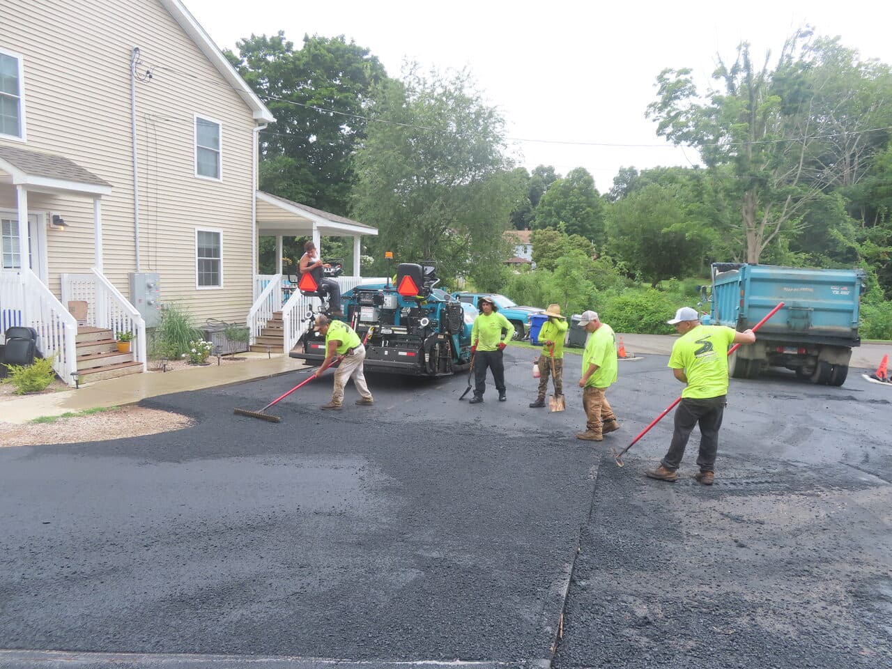 Before — Commercial Parking Lot Paving in Branford, CT (crew brooming fresh asphalt)