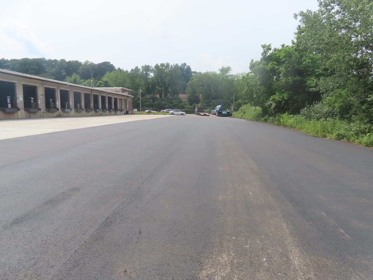 Commercial Parking Lot Paving project in Northford, CT — finished asphalt lot along loading dock