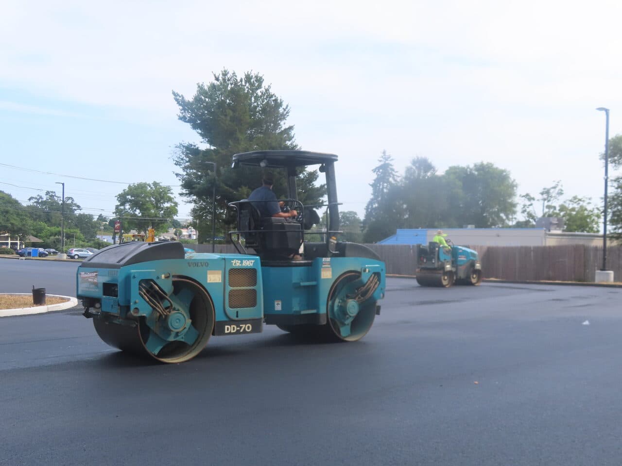 Commercial Parking Lot Paving project in Orange, CT — two rollers compacting parking lot