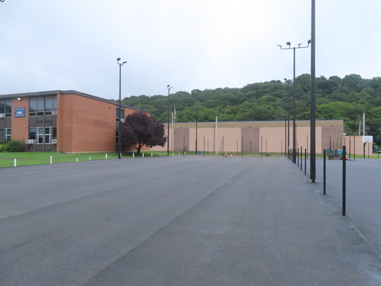 Commercial Parking Lot Paving project in East Haven, CT — finished lot by school building