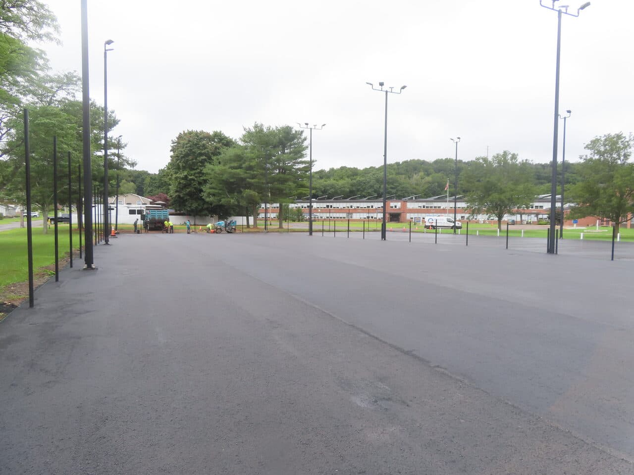 Commercial Parking Lot Paving project in East Haven, CT — finished lot wide with school