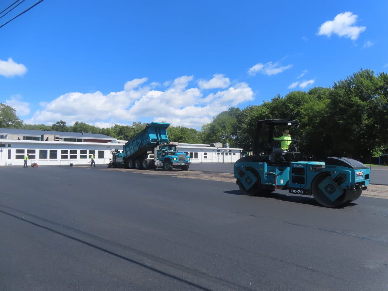 Commercial Parking Lot Paving project in Bloomfield, CT — roller and dump truck paving lot