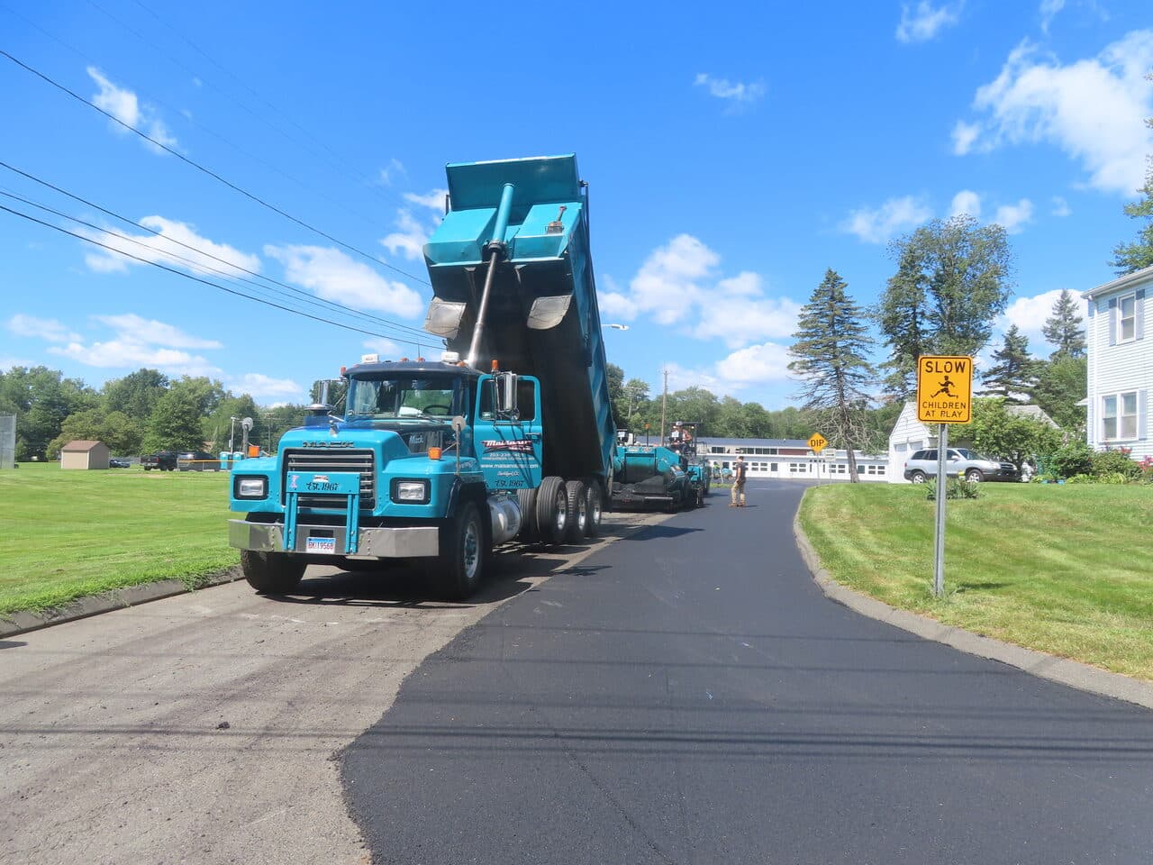 Commercial Parking Lot Paving project in Bloomfield, CT — branded dump truck on new street