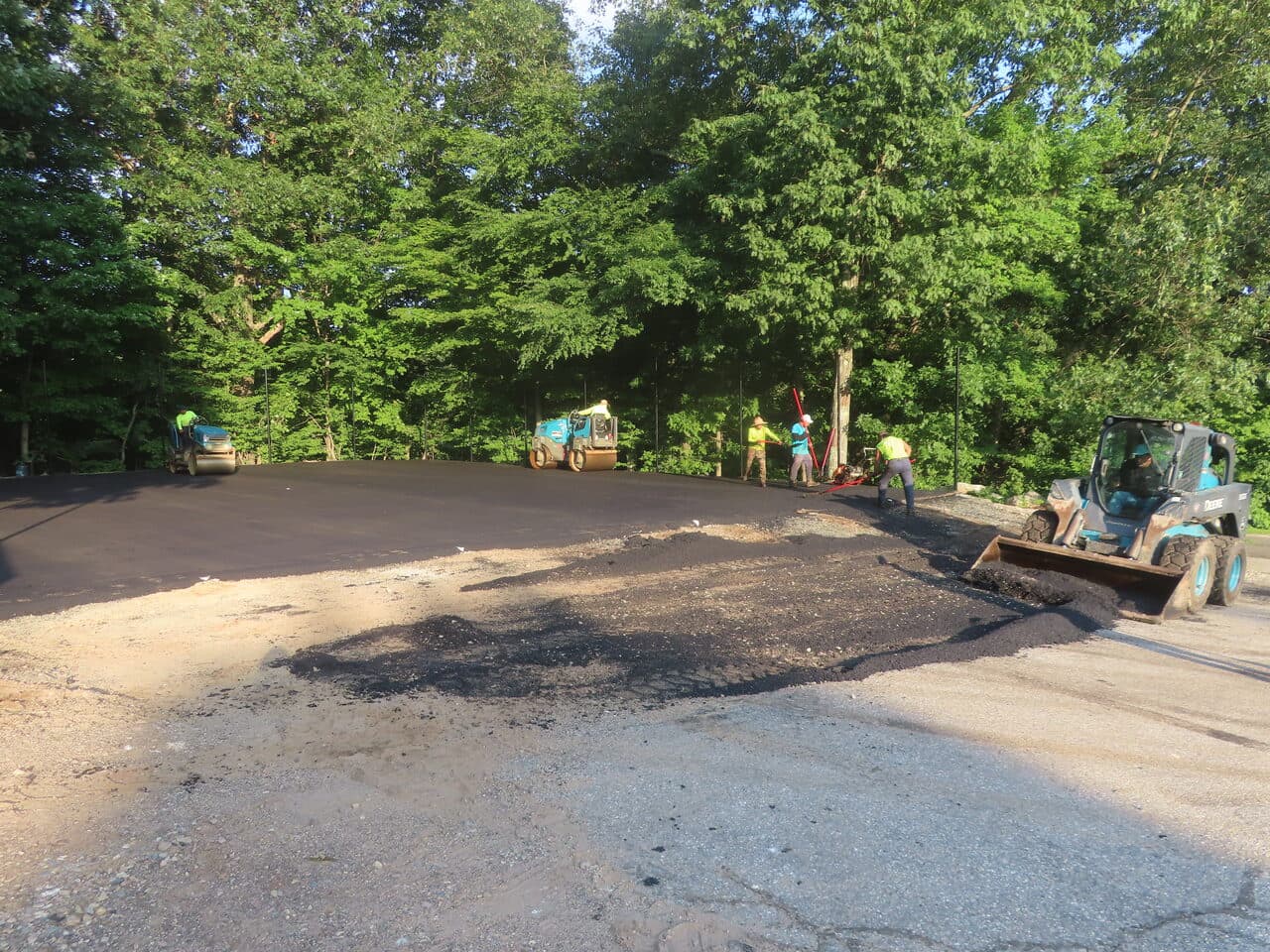 Commercial Parking Lot Paving project in Bloomfield, CT — rollers and skid steer compacting base