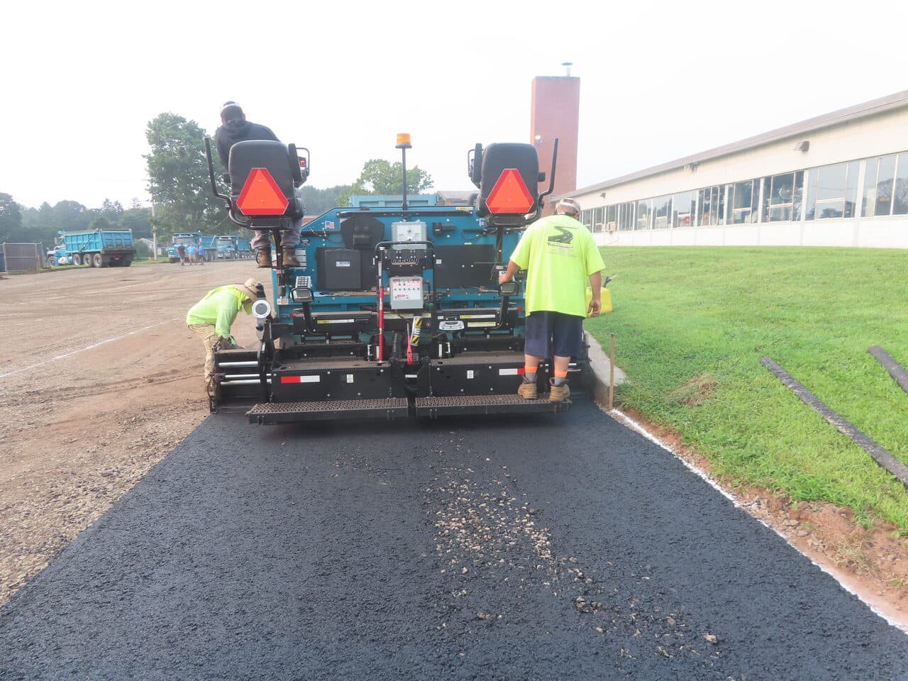 Commercial Parking Lot Paving project in Montowese, CT — paver laying asphalt edge