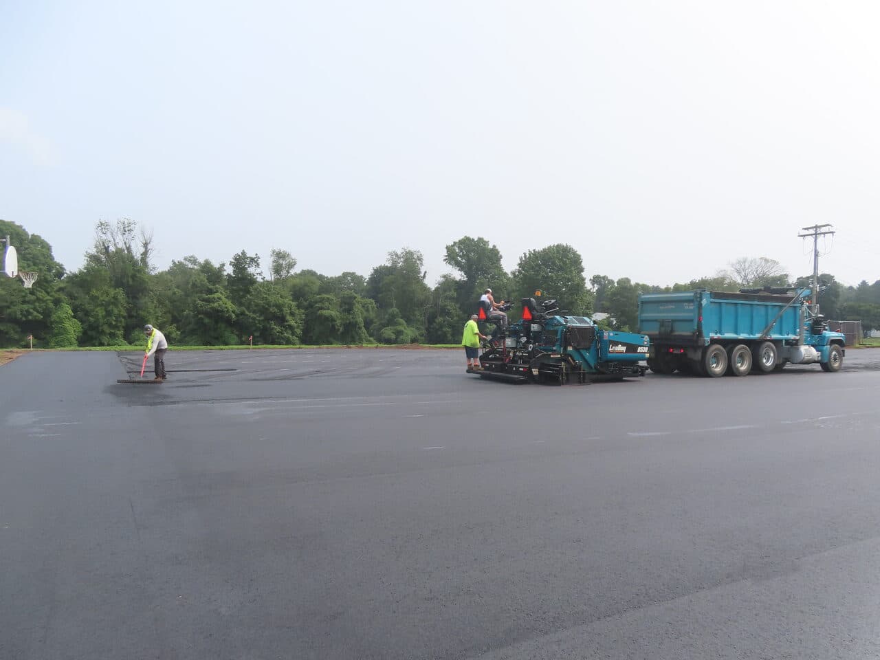Commercial Parking Lot Paving project in Montowese, CT — paving crew with paver and truck
