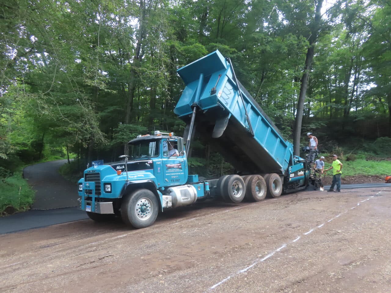 Commercial Parking Lot Paving project in North Branford, CT — Mack dump truck feeding asphalt paver