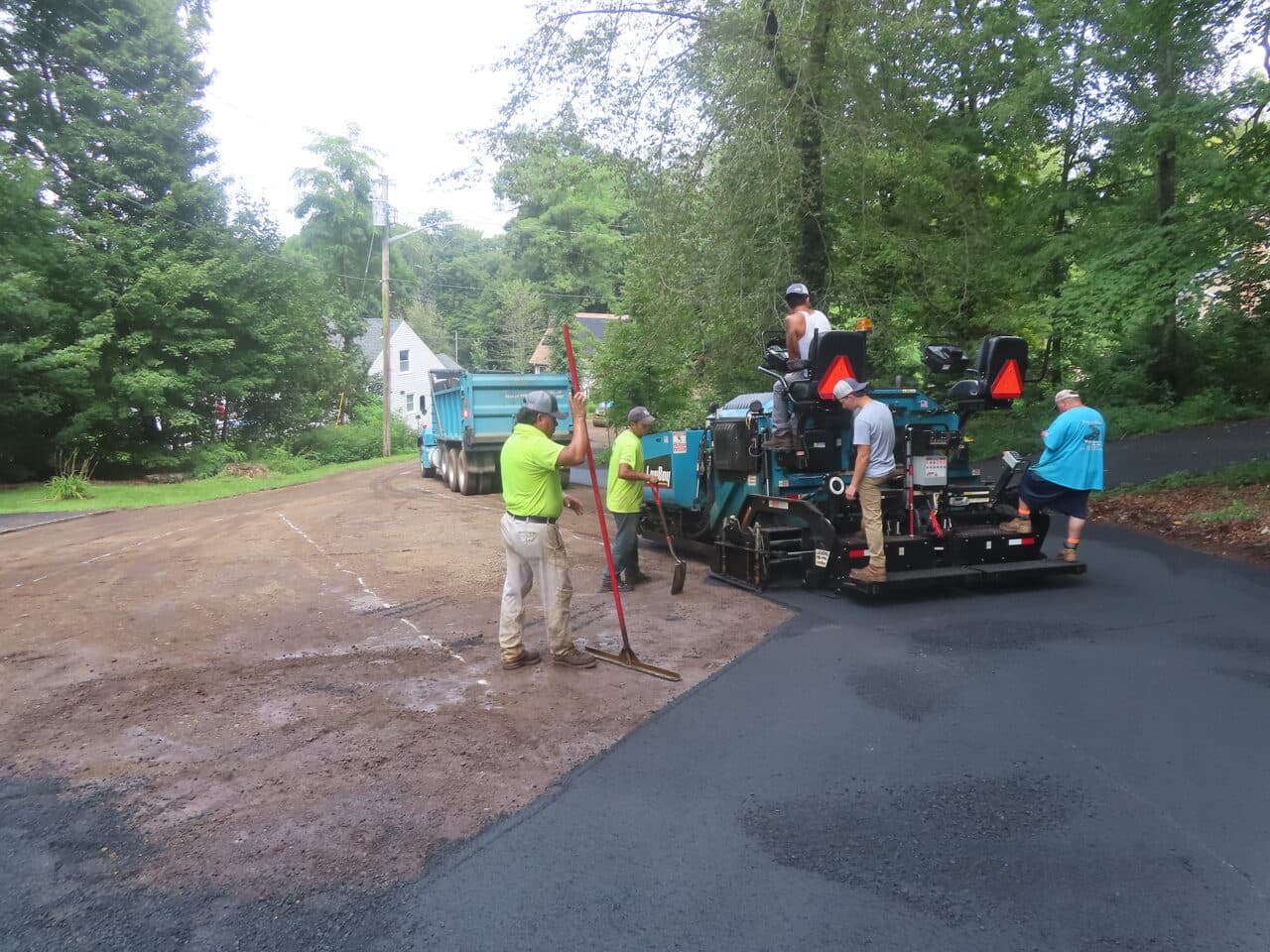 Commercial Parking Lot Paving project in North Branford, CT — crew paving driveway with paver