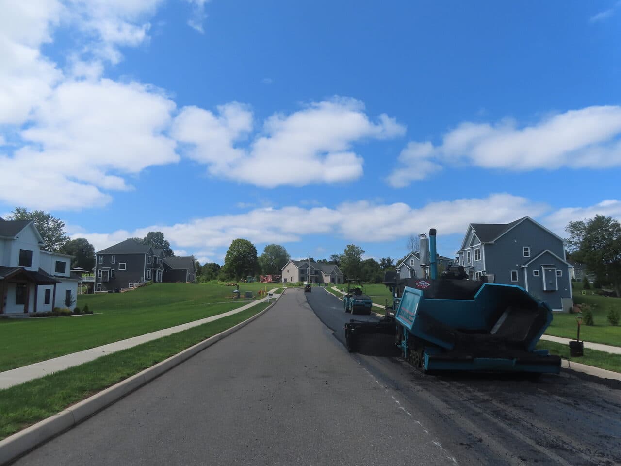 Roadway Paving project in Cheshire, CT — fresh paved road through subdivision