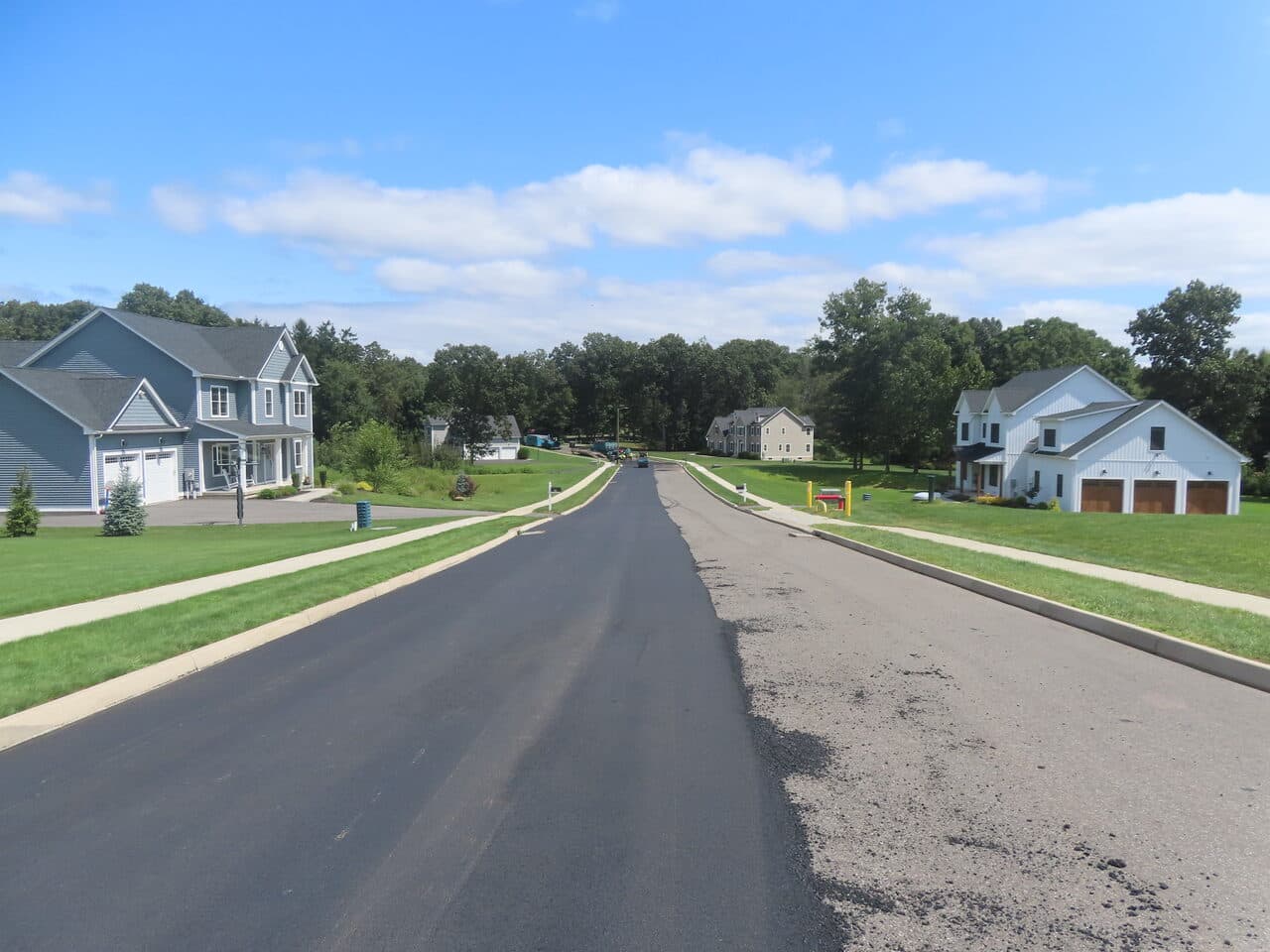 Roadway Paving project in Cheshire, CT — finished road with new homes