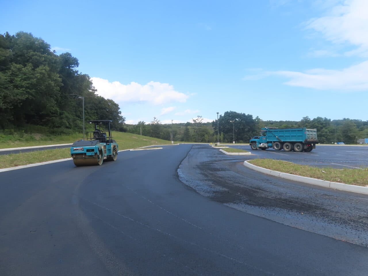 Commercial Parking Lot Paving project in Brookfield, CT — roller and dump truck on new lot