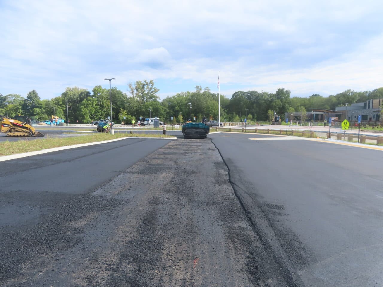 Commercial Parking Lot Paving project in Brookfield, CT — fresh asphalt entrance drive lane