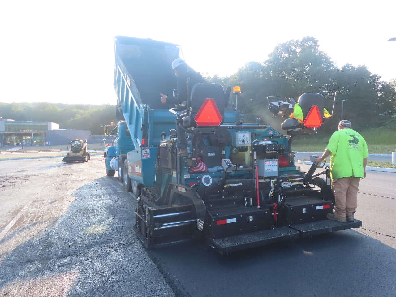 Commercial Parking Lot Paving project in Brookfield, CT — paver loading from dump truck