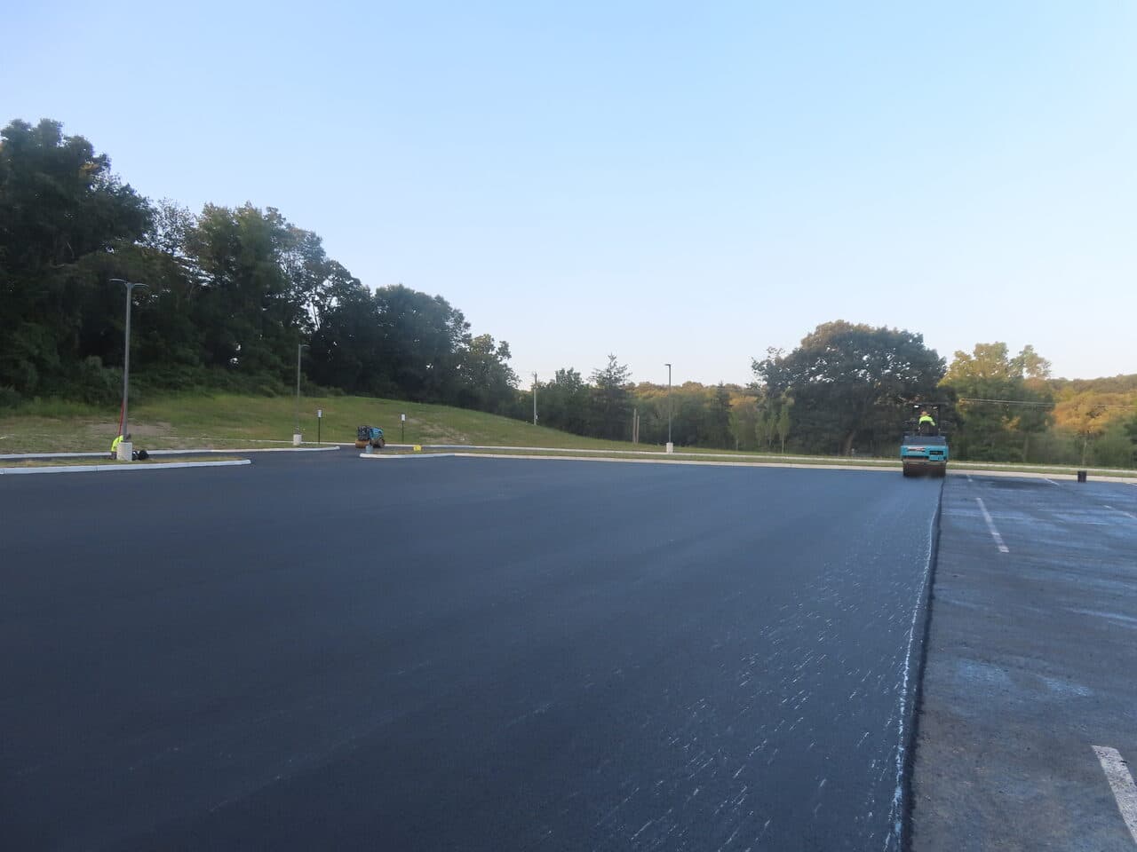 Commercial Parking Lot Paving project in Brookfield, CT — wide fresh paved lot at dusk