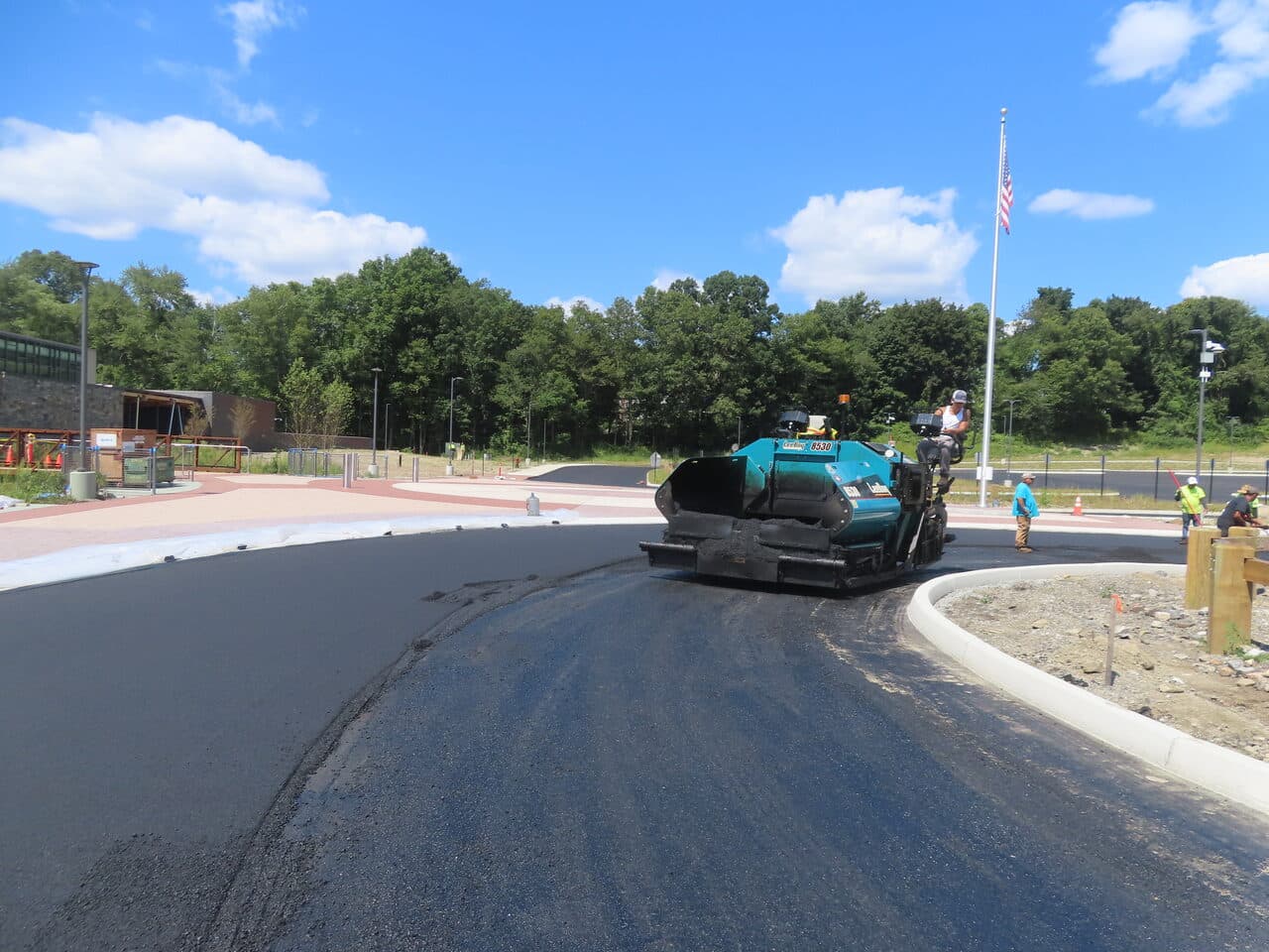 Commercial Parking Lot Paving project in Brookfield, CT — LeeBoy paver laying asphalt on drive