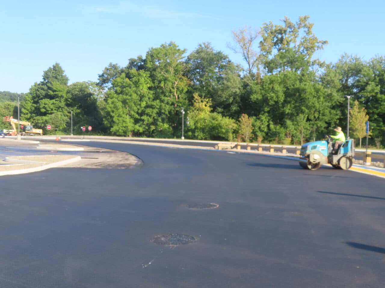 Commercial Parking Lot Paving project in Brookfield, CT — roller compacting finished lot
