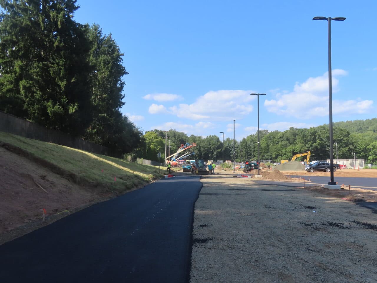 Commercial Parking Lot Paving project in North Branford, CT — new access drive curving toward site