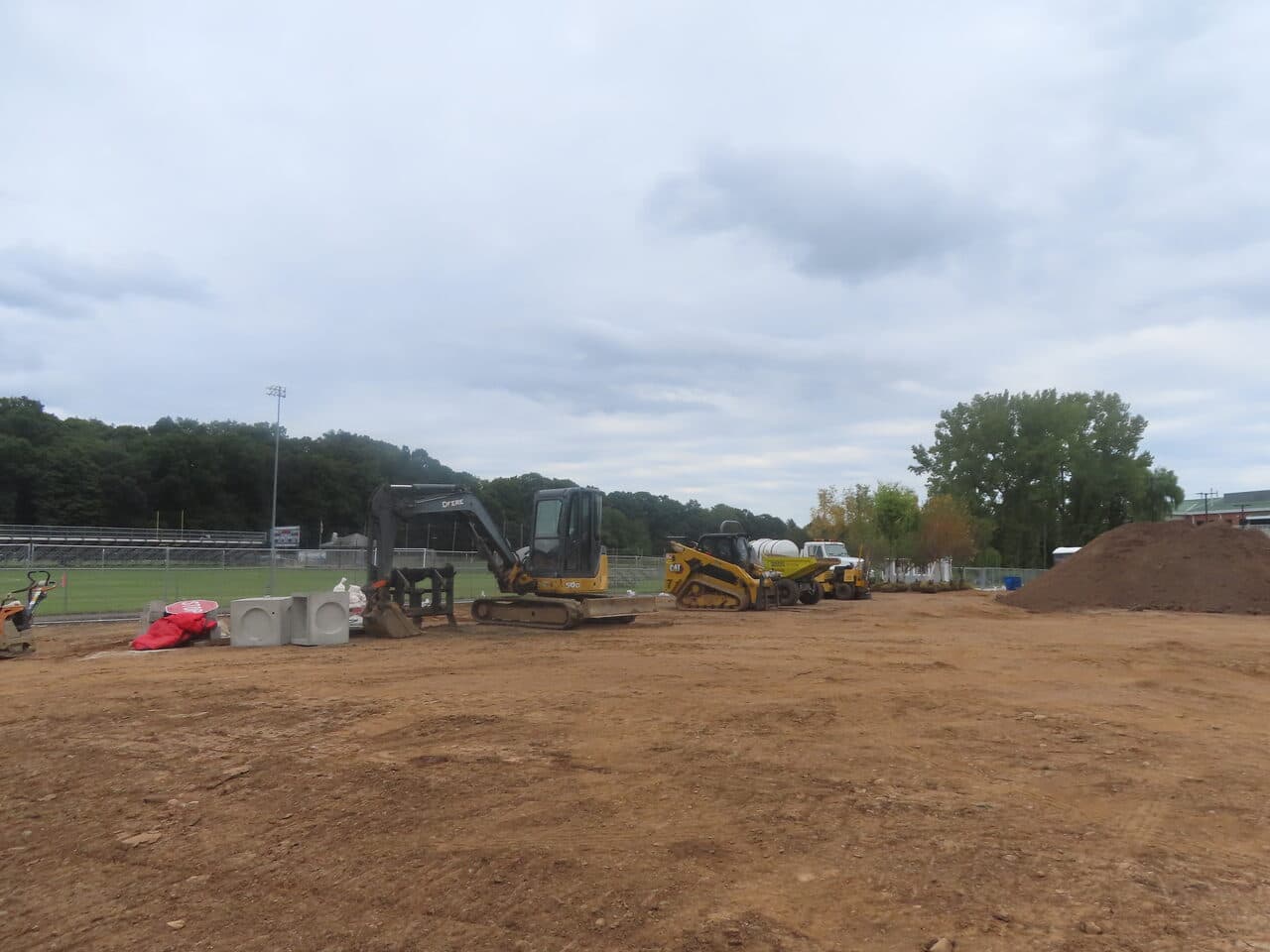 Commercial Parking Lot Paving project in North Branford, CT — excavator and skid steer on site