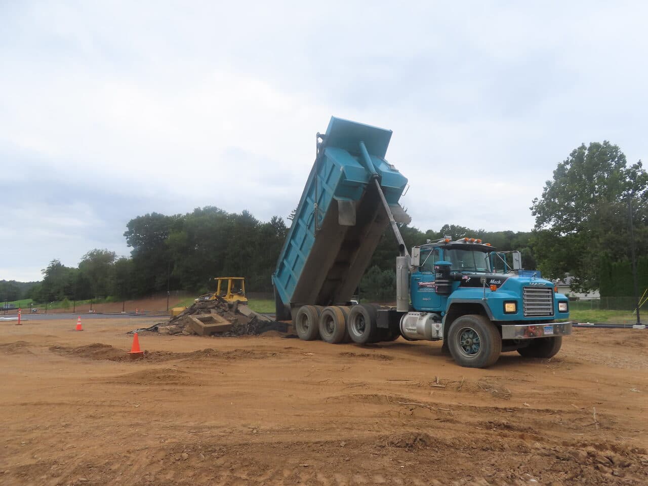 Commercial Parking Lot Paving project in North Branford, CT — dump truck unloading material