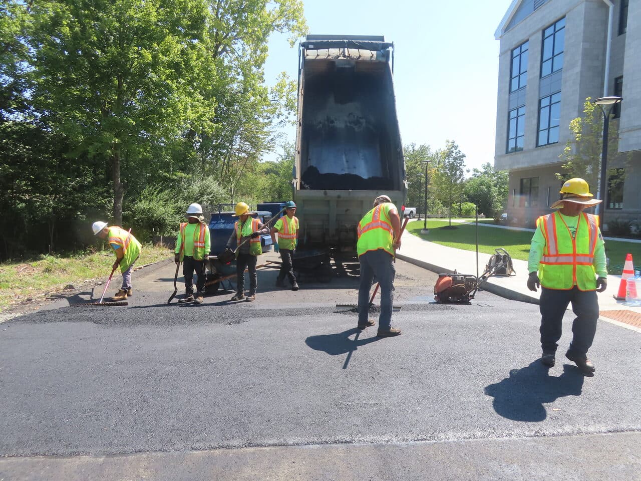 Commercial Parking Lot Paving project in North Branford, CT — crew paving lot by building