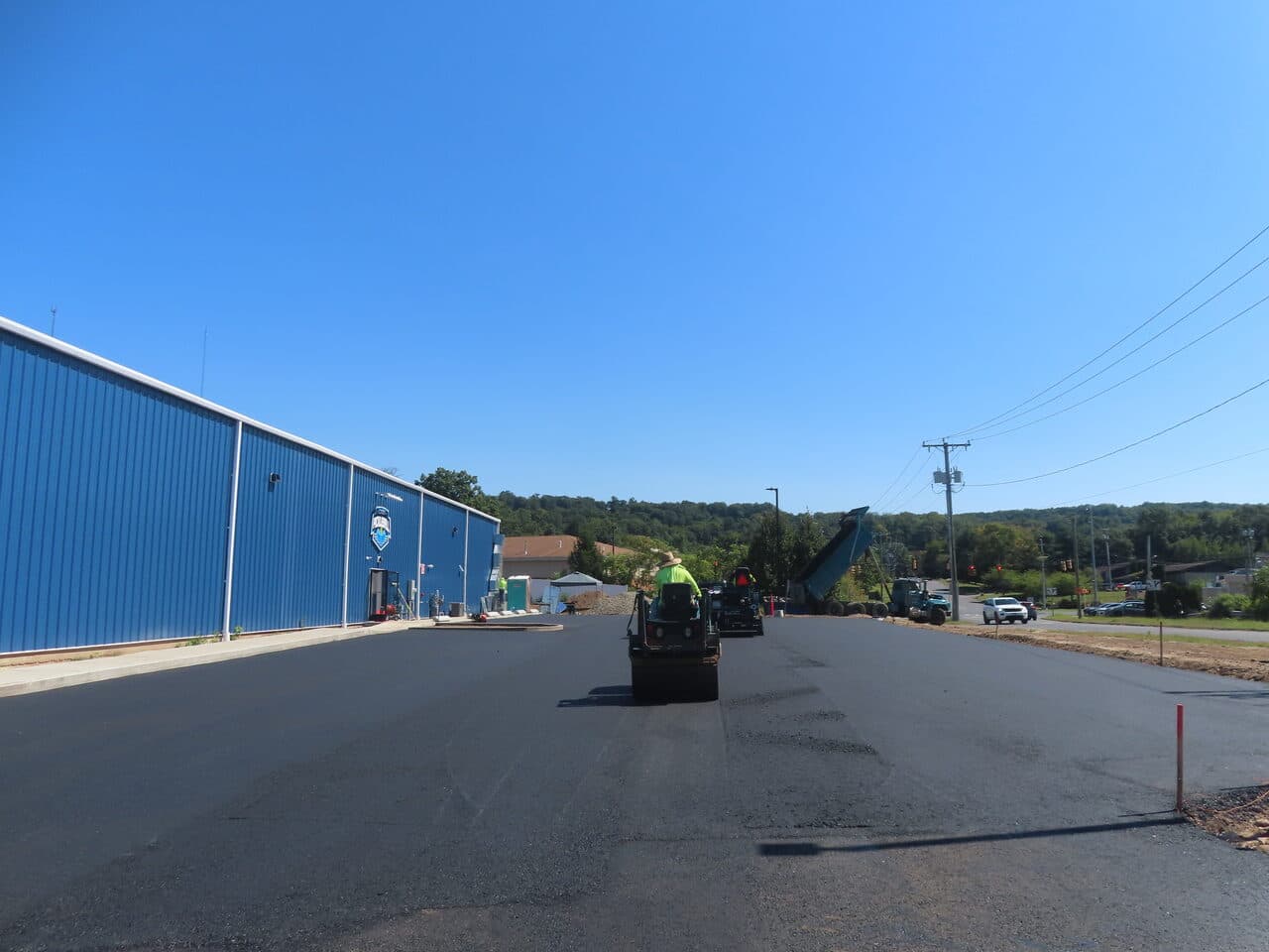 Commercial Parking Lot Paving project in Plainville, CT — fresh asphalt paving at commercial building
