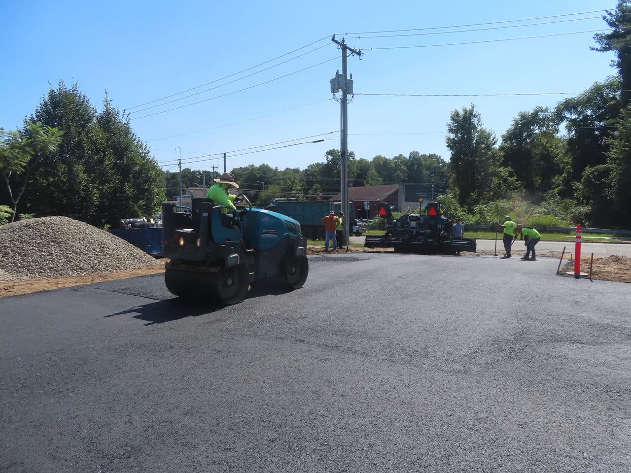 Commercial Parking Lot Paving project in Plainville, CT — crew paving with roller and paver