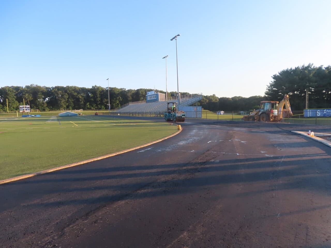 Athletic Surface Base Paving project in Southington, CT — graded track base before paving