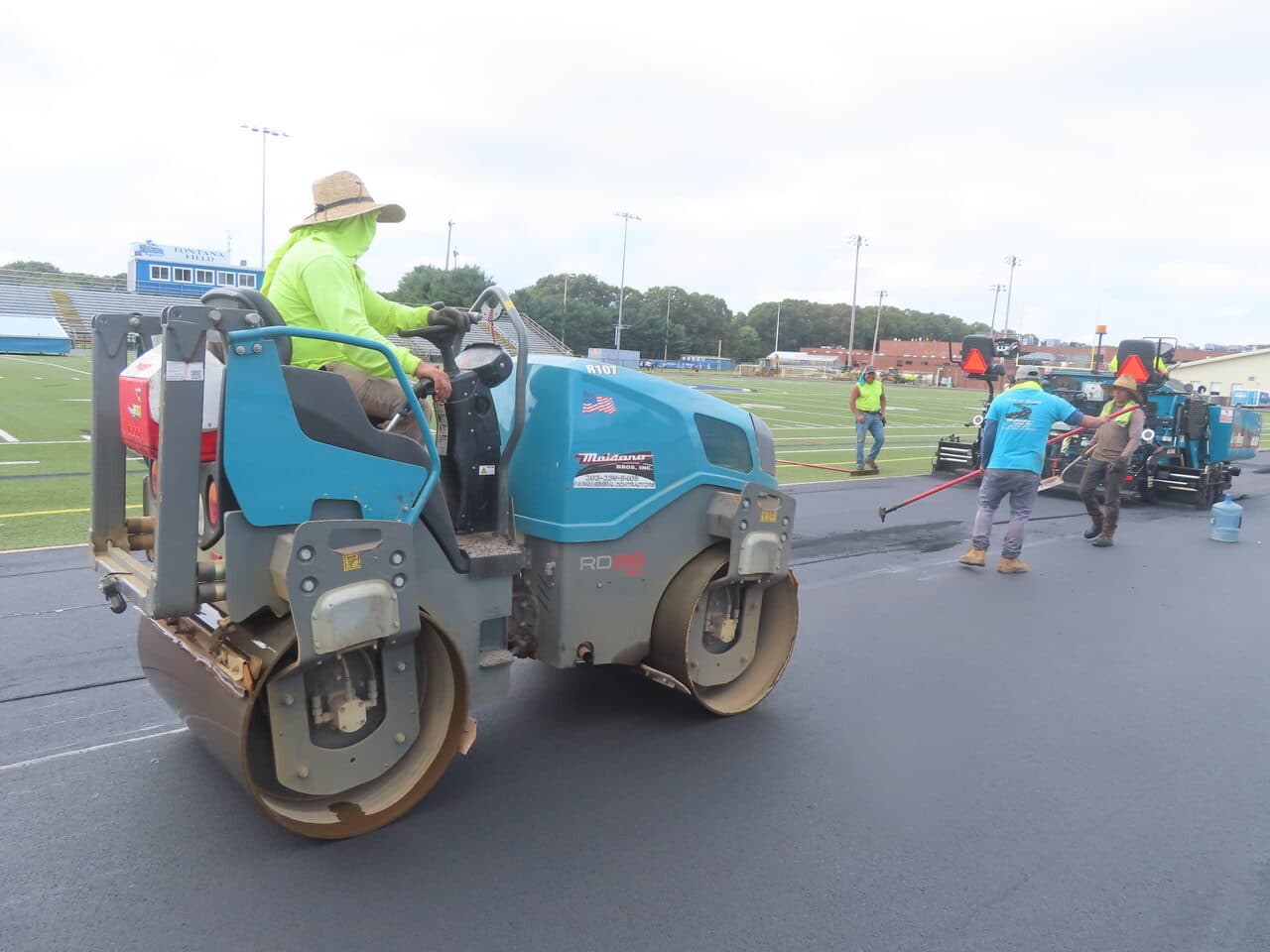 Athletic Surface Base Paving project in Southington, CT — rollers compacting fresh asphalt track