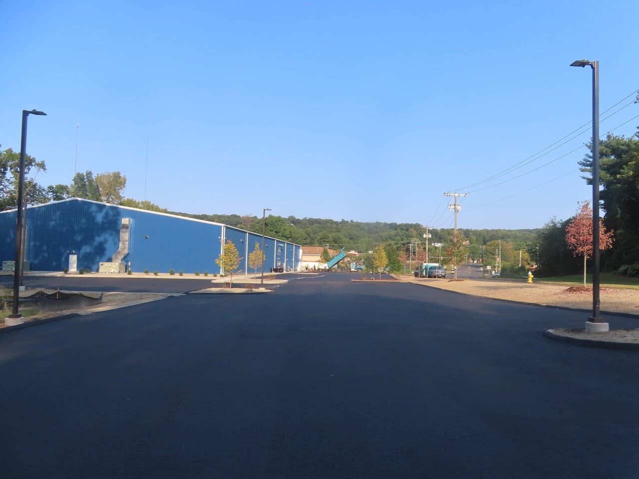 Commercial Parking Lot Paving project in Plainville, CT — wide finished lot and drive aisle