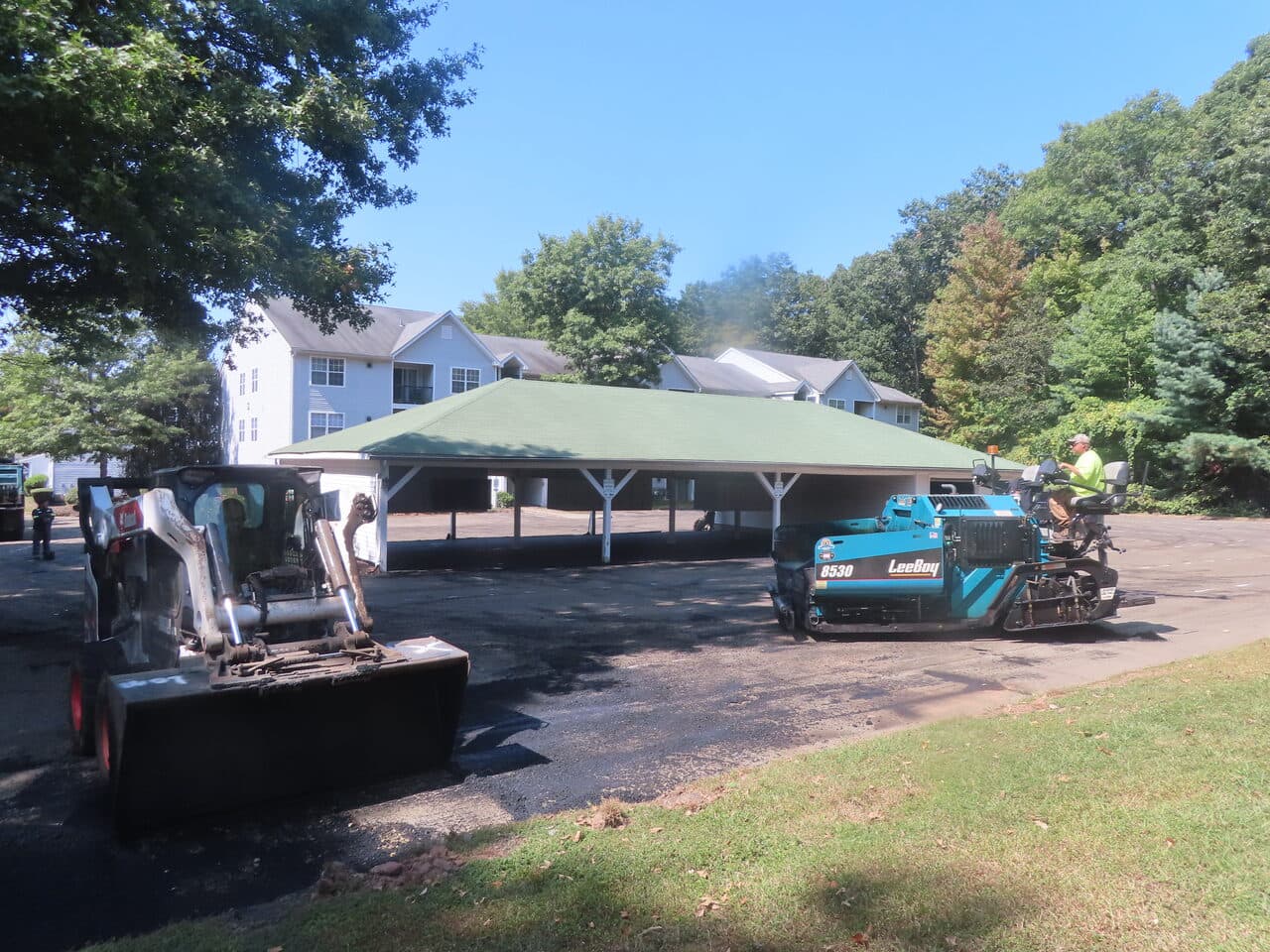 Commercial Parking Lot Paving project in Hamden, CT — skid steer and LeeBoy paver onsite