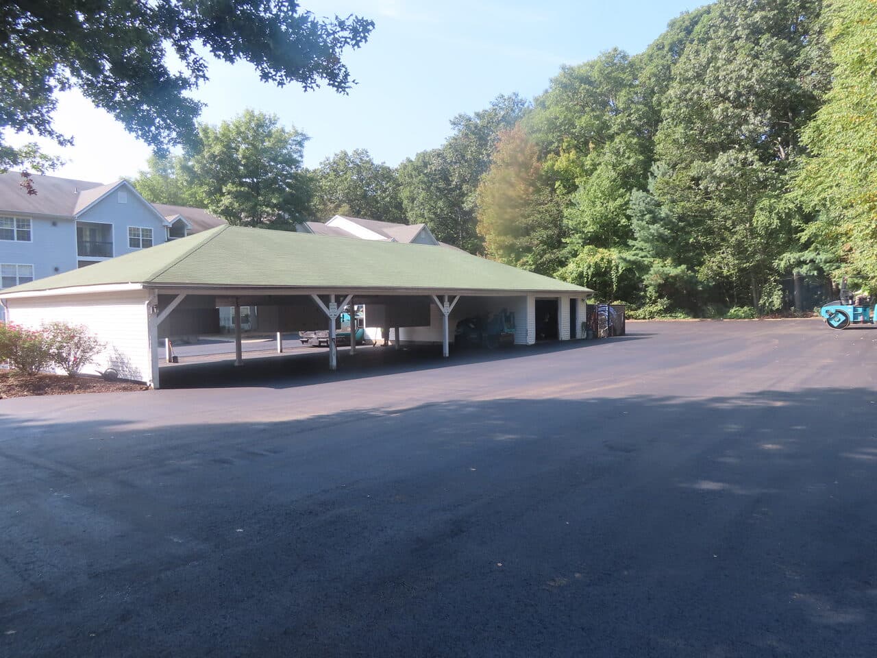 Commercial Parking Lot Paving project in Hamden, CT — wide finished asphalt lot and carport
