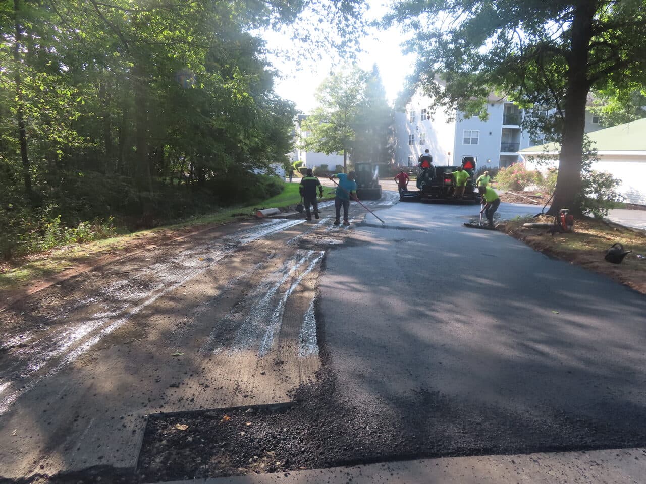 Commercial Parking Lot Paving project in Hamden, CT — crew raking edge before paving lane